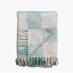 mint green and cream plaid blanket