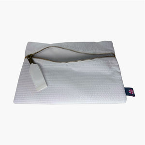 white seersucker cosmetic bag